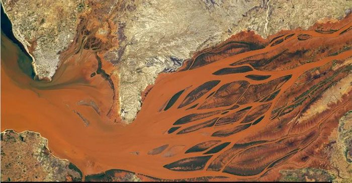 Brown-red waters of the Betsiboka River in Madagascar taken on September 30, 2023