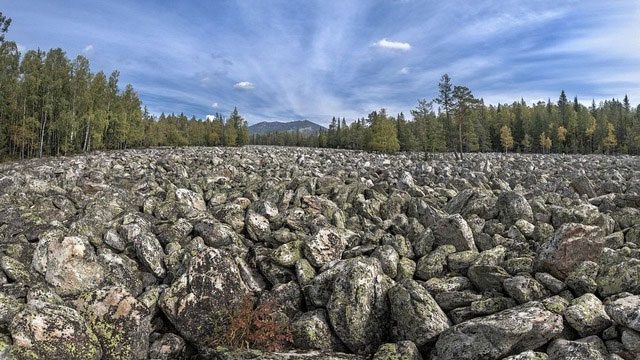 Under the weight of glaciers, the mountain peaks were crushed into millions of large stones.