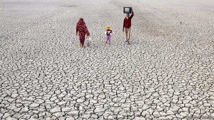 Villagers on the dry riverbed in Bangladesh