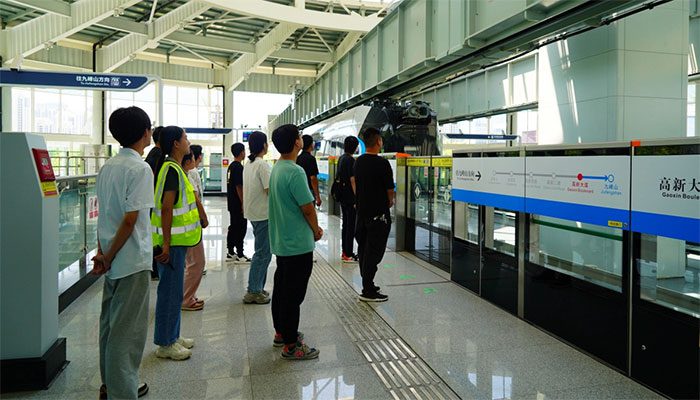 Passengers waiting for the train to arrive.