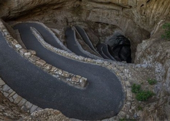 the road behind the deep penetration into the ground blocking the 75 story building 129568