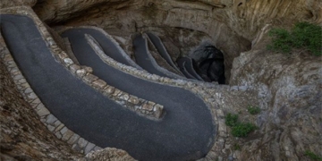 the road behind the deep penetration into the ground blocking the 75 story building 129568