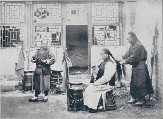 Barber walking around the streets with his tools.
