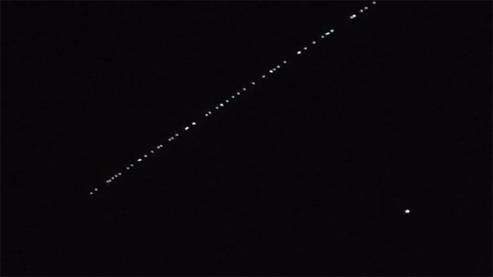 Starlink satellites moving in low orbit as seen from Earth.