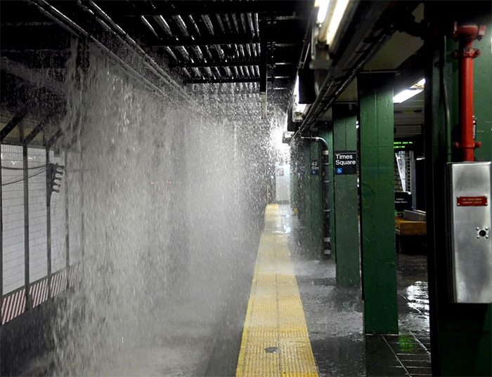 Water flooding the subway tracks after the main pipe burst