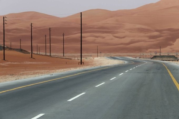 A highway running through the arid landscape of Saudi Arabia.