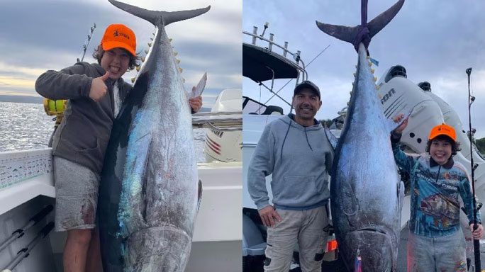 Jakim Azzopardi and his father beside the giant bluefin tuna.