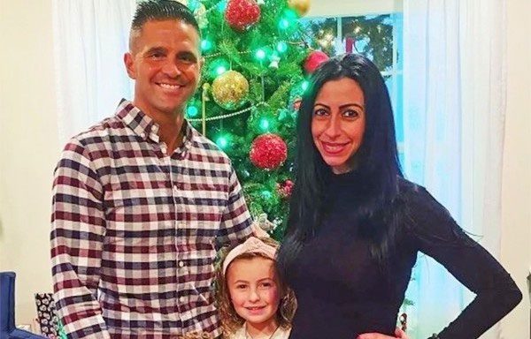 Mark Mongiardo with his wife and child.