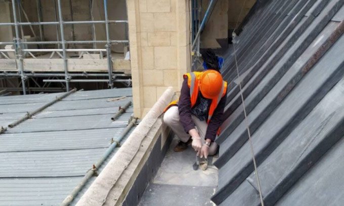Researcher Matthias van Ginneken collecting cosmic dust on the roof of Canterbury Cathedral.