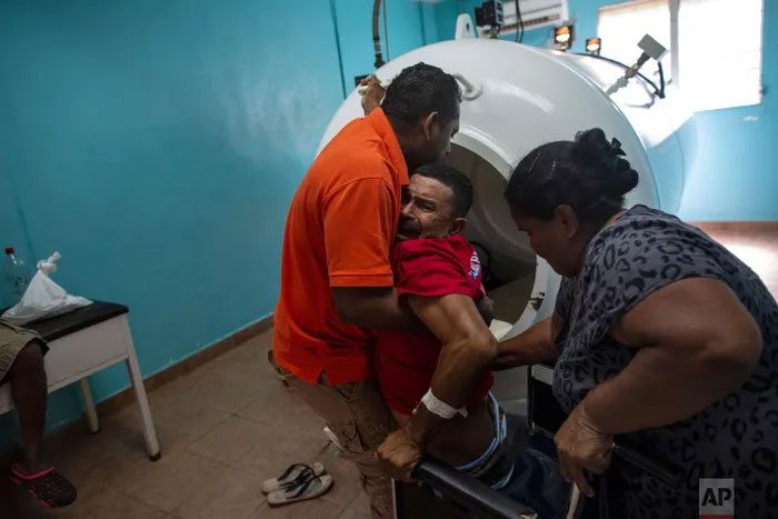 Lobster diver Misael Banegas Díaz being taken into a decompression chamber