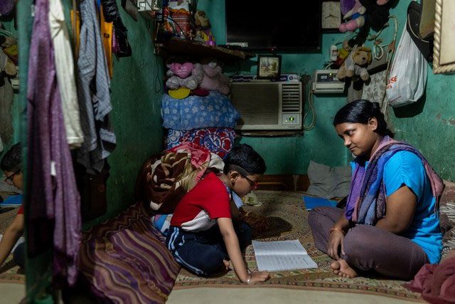 Piyu Haldar and her son, Yasir, at home in New Delhi.