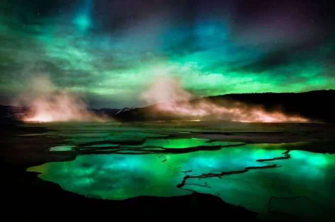 The light from the aurora and the lake surface resemble beautiful, colorful ribbons.