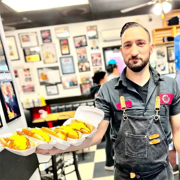 Adam continues his father's tradition of selling onion sandwiches.