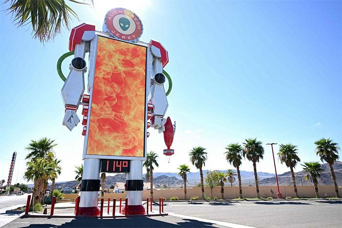 Thermometer displaying 114°F (45.5°C) in Baker, California, USA.