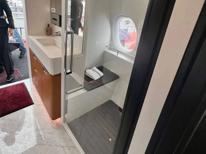 The bathroom also has seating for guests to enjoy the view outside.