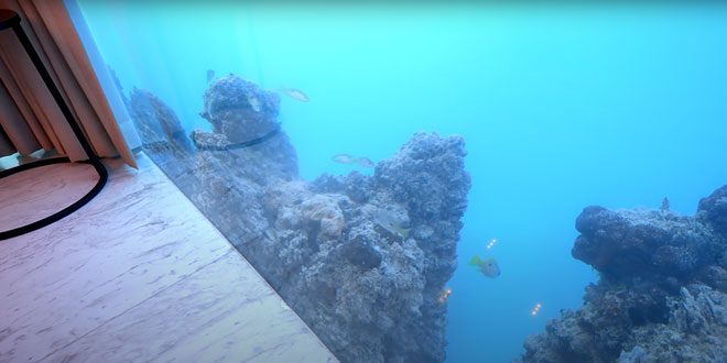 The second-floor bedroom is located deep underwater, with a direct view of the ocean