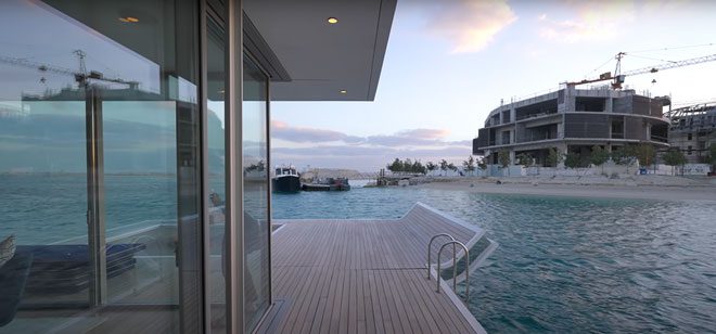 The uniquely designed floating house is likened to a super yacht