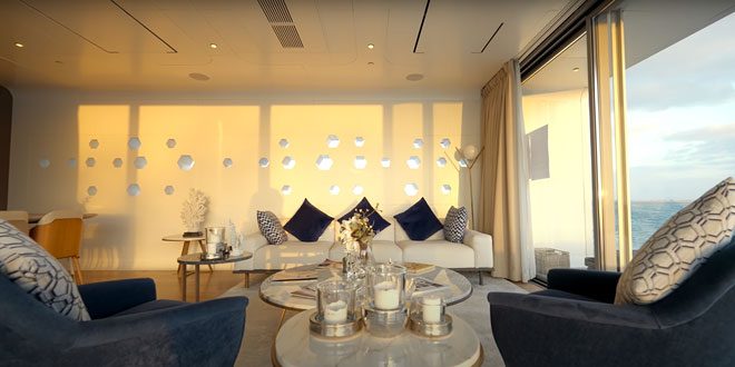 The living room with a premium marble coffee table at its center.