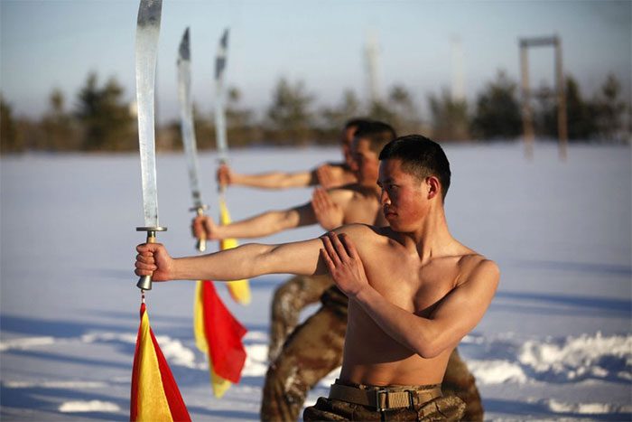 Chinese soldiers practicing sword fighting