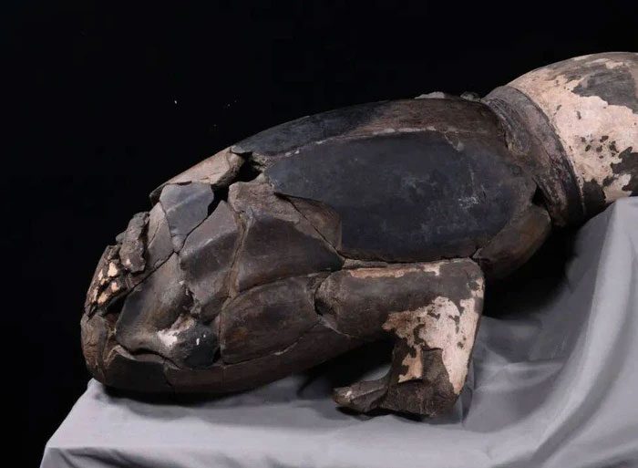 The terracotta figure in a strange lying posture in the tomb of Qin Shi Huang.