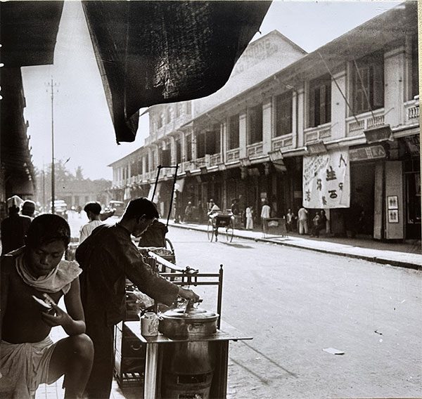 Food stall selling steamed dishes in 1930.