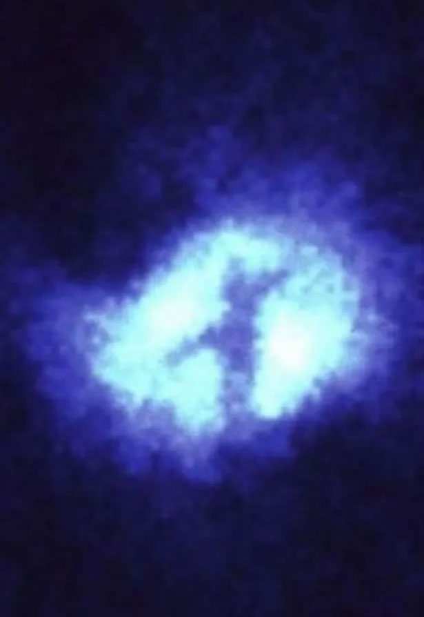 The cross-shaped structure in deep space resembles a cross.