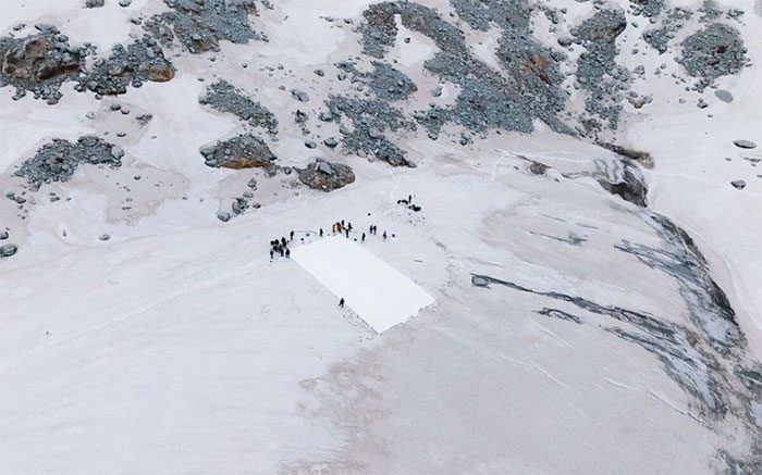 Covering part of Dagu Glacier with a reflective sunshade on June 30