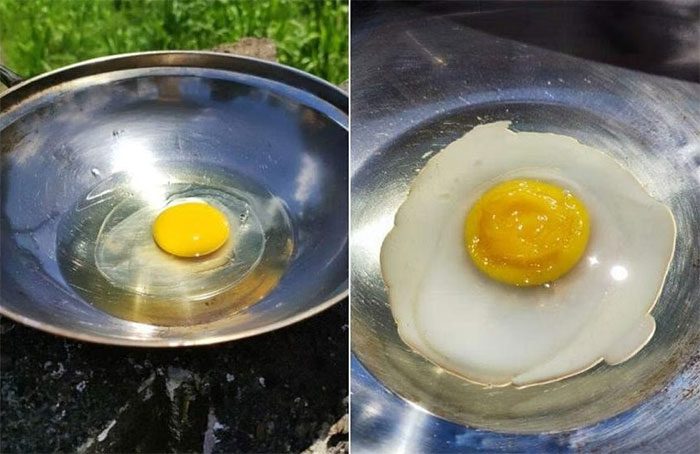 A woman in Malaysia cooked eggs on a pan outdoors in the heat on May 12