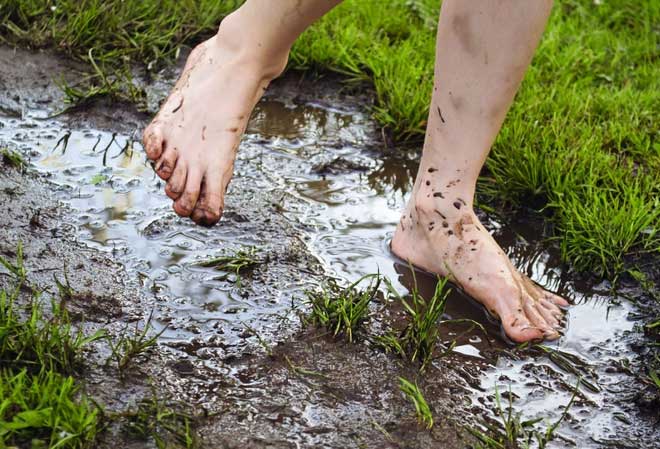 Walking barefoot in areas that may contain feces increases the risk of infection with parasitic worms.