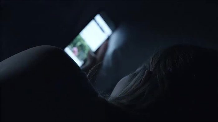 Blue light from screens reduces melatonin production, leading to insomnia.