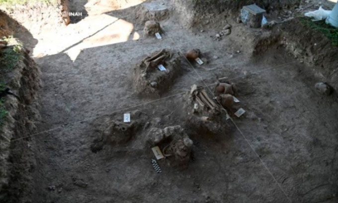Some skeletons at Structure 18 pyramid.