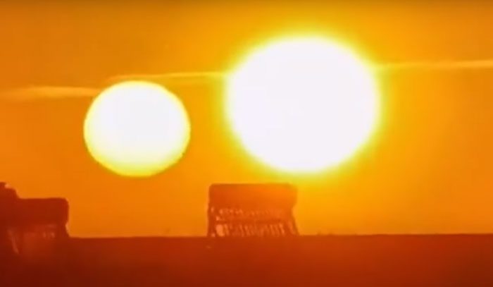 The phenomenon of multiple suns appearing in the sky is called Parhelion.