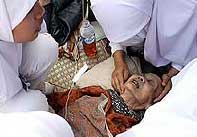 Doctors treating an injured person