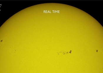 international space station flying over the dark spot on the wide sun 128096
