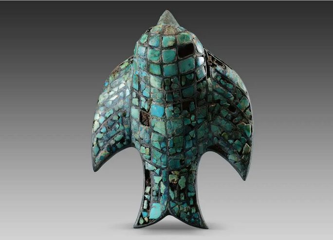 Eagle-shaped turquoise belt buckle from the tomb