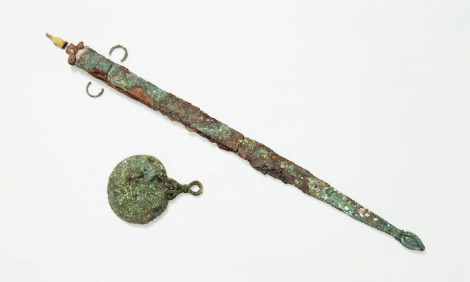 The Iron Age sword and mirror found in the tomb on Bryher Island.