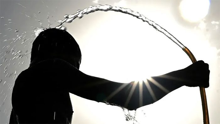 Residents cooling off during a severe heatwave in New Delhi, India.