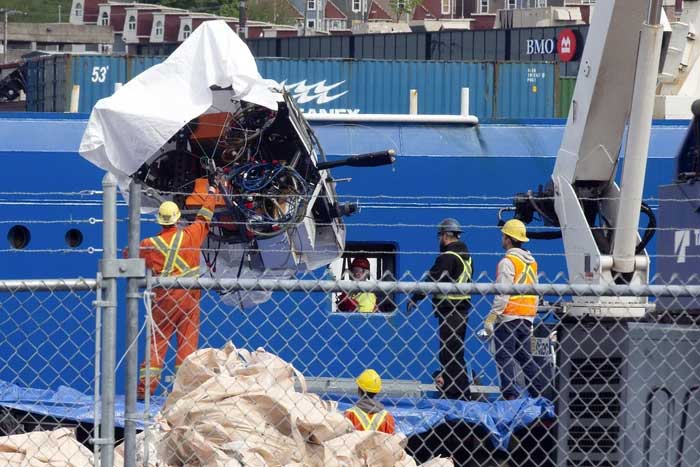 Debris from the submersible being recovered.