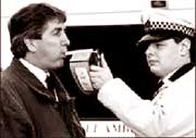 Police checking the breath of citizens to detect terrorists.
