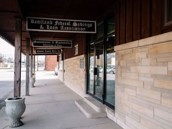 The bank's facade, next to a law office and a family business