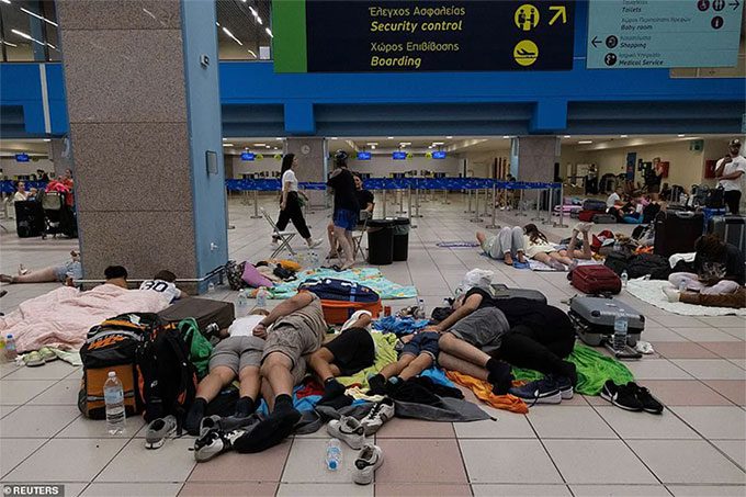 Many people waiting at the airport to return to their home countries.