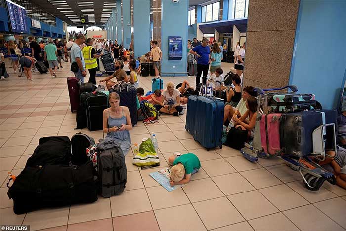 Families with young children anxiously waiting to board flights.