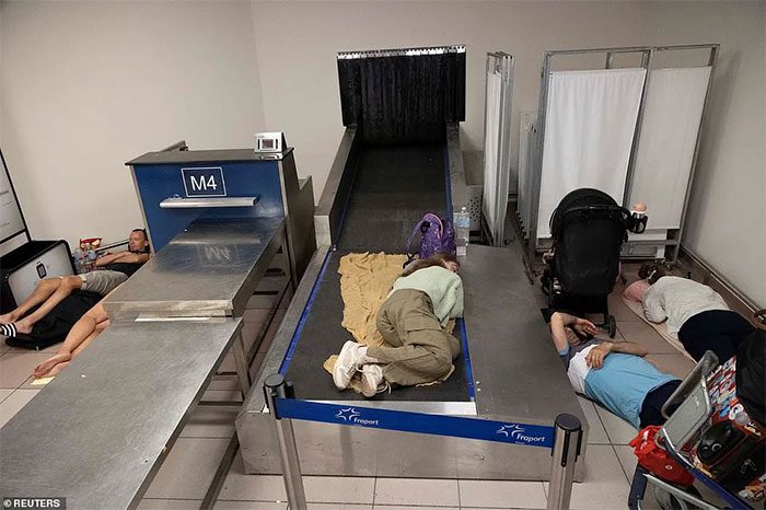 Everywhere from the floor to the baggage claim area was utilized as a place to rest.