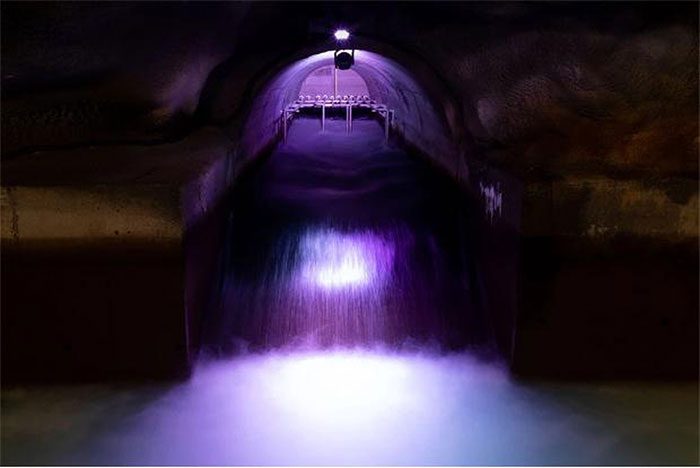 Water flowing into the underground conditioning basin of the Sant'Antonio Hydroelectric Plant.
