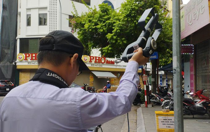 Officials from the Radio Frequency Department using testing equipment on Vong Street, June 22.
