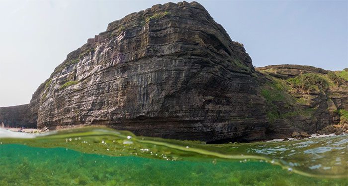 The nature at Cau Cave is pristine with the sea on one side and the cliff on the other.