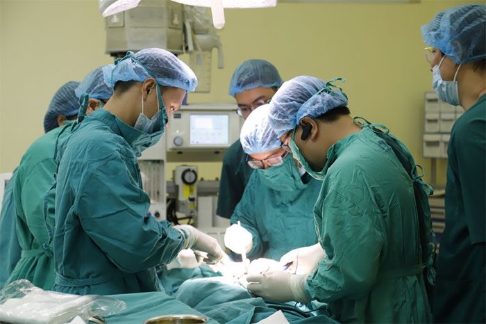 Doctors at K Hospital perform surgery on patients.