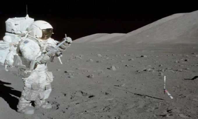 Harrison H. Schmitt collecting lunar samples during Apollo 17.