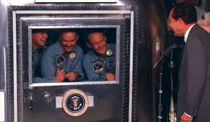 U.S. President Richard Nixon welcomes the Apollo 11 astronauts back to Earth