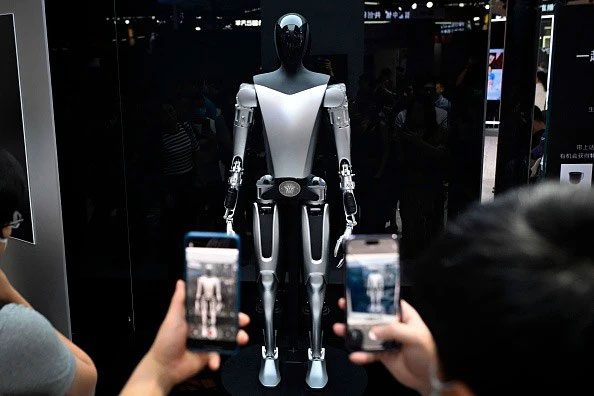 Tesla's Optimus robot, approximately 1.73 meters tall and weighing 56.7 kg